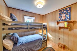 a bedroom with two bunk beds and a window at Vacation Rental Home about 2 Mi to Windham Mountain! in Windham