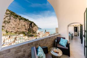 a balcony with a view of the city at Maika House - Amalfi Coast - Seaview in Atrani