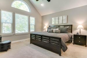 a bedroom with a large bed and two windows at Ski Haven in Salt Lake at Base of Big Cottonwood in Cottonwood Heights