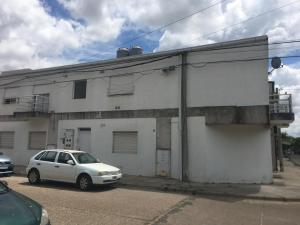 a white car parked in front of a building at Milli in Gualeguaychú