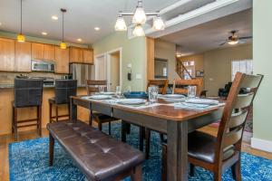a dining room and kitchen with a table and chairs at Urban Central in Salt Lake with Indoor Hot Tub in Salt Lake City
