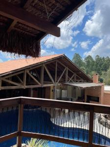 a balcony of a house with a swimming pool at G14 Eventos in São Bento do Sul