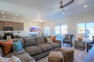 a living room with a couch and a kitchen at 19| Vue at Green Valley with Community Pool in St. George