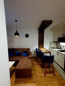 a living room with a couch and a table at Apartman Felicita 2 in Zlatibor