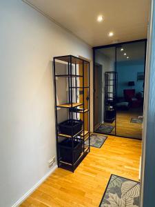 a room with a room with shelves in it at Turku Downtown Cozy Flat with balcony 45m2 in Turku
