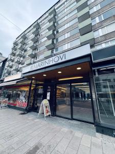 a store front of a building with a sign on it at Turku Downtown Cozy Flat with balcony 45m2 in Turku