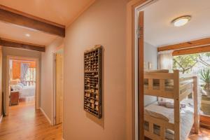 a room with a bunk bed and a wine cellar at Ballots Bay Treehouse by Host Agents in George