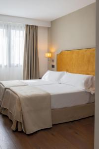 Ένα ή περισσότερα κρεβάτια σε δωμάτιο στο Hotel Infanta Leonor
