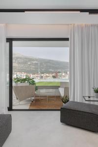 a living room with a view of a city at No Stars - Luxury Hotel Apartments in Ioannina