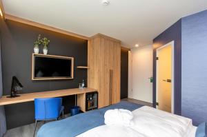 Postel nebo postele na pokoji v ubytování Privat & Boutique Hotel Plauer See