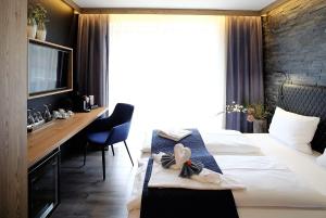 Postel nebo postele na pokoji v ubytování Privat & Boutique Hotel Plauer See