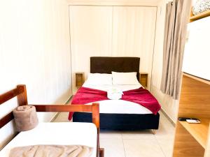 Uma cama ou camas num quarto em Hospedagem Quinta do Correia