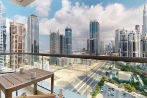 a balcony with a view of a city skyline at West Heights 1 - Vacationer in Dubai