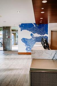 a lobby with a wall with a map on it at Blue Horizon Hotel in Vancouver