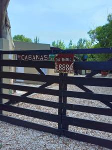 a fence with a sign that reads cabanasas on it at CABAÑAS DEL INDIO 888 in Mar de Cobo