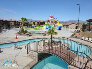 a pool in a park with a playground at 5-7 | 3 Homes in St. George with Covered Patio Views in Santa Clara
