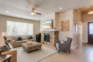 a living room with a couch and a fireplace at 5-7 | 3 Homes in St. George with Covered Patio Views in Santa Clara