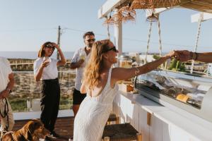 a bride and groom on the deck of a boat at We Surf House in Figueira da Foz