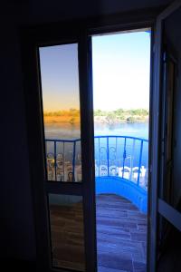 a view of a river from a balcony at Nubian Popeye - Roof top - Nile View in Aswan