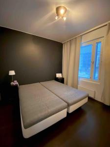 A bed or beds in a room at Brand New and Cozy Modern Studio! WithAirCondition