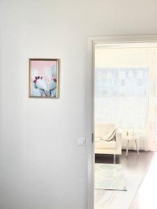 a room with a door with a picture on the wall at Brand New and Cozy Modern Studio! WithAirCondition in Turku