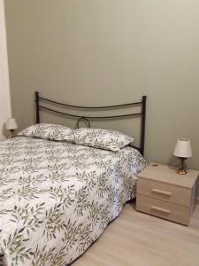 Кровать или кровати в номере La Casa di Abe - Cuneo