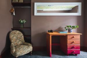 a room with a chair and a table and a drawer at Fourteen Providence Place, Calstock, Cornwall, self catering cottage in Calstock