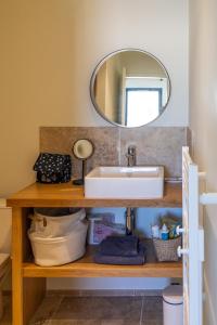 a bathroom with a sink and a mirror at Vie Ventoux in Malaucène