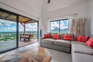 Posezení v ubytování Villa Teranga avec vue panoramique sur la baie de Tamarin