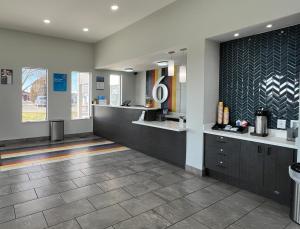 a large bathroom with a sink and a counter at Studio 6 Ogden, UT 21st Street in Ogden