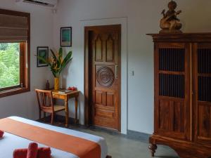 Postel nebo postele na pokoji v ubytování SLOW - Villa & Café