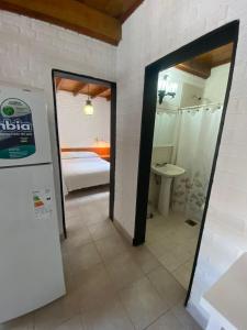 a bathroom with a door leading to a bedroom at CASA "SONNIA" pleno centro, 200 mts de la peatonal y 300 mts del mar in Las Grutas