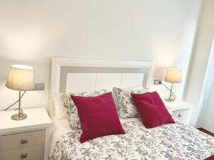 En eller flere senge i et værelse på Apartamento Europa Prados - Atenea