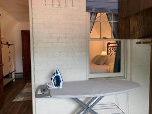 a tiny bedroom with a bed in a window at Nice 1 BR Apt, WIFI & Office, Near State Fair in West Allis