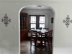 a dining room with a table and chairs at Nice 1 BR Apt, WIFI & Office, Near State Fair in West Allis
