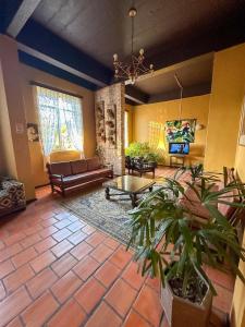 a living room with a couch and a table at Hotel Cavalinho Branco in São Francisco de Paula