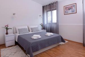 Posteľ alebo postele v izbe v ubytovaní Apartman Ivo