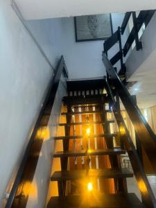 an overhead view of a staircase in a building with lights at Merry Villa in Lagos