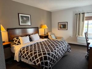 a hotel room with a bed and a window at Clock Tower Inn in Berne