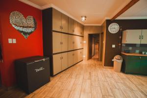 a kitchen with a heart hanging on the wall at I Stay @ De 22 On Vintage in Windhoek