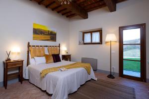 מיטה או מיטות בחדר ב-Podere La Casella
