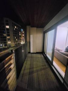 a room with a balcony with a view of a building at Striking 1 bedroom apartment in Manchester
