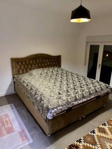 a bed sitting in a room with a bed sidx sidx at Villa Noari, Brezovice. in Brezovica