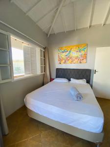Tempat tidur dalam kamar di Boa vista