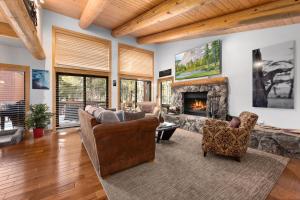 a living room filled with furniture and a fireplace at Rocky Point # 14 Palisades Townhome - Ski Shuttle w Tennis! in Olympic Valley