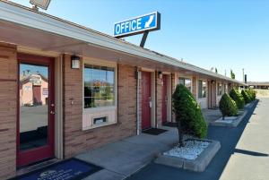 a building with a sign on the side of it at Americas Best Value Inn & Suites Klamath Falls in Klamath Falls
