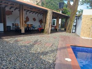 a patio with a pool and a house at Quinta Villateo in Villavicencio