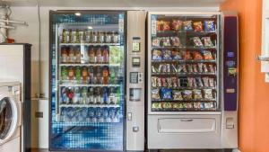 a refrigerator filled with lots of drinks and soda at Motel 6-Fremont, CA - South in Fremont