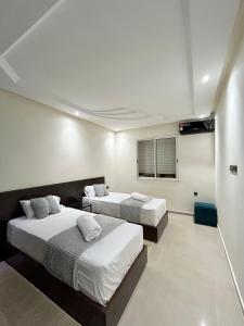 Posteľ alebo postele v izbe v ubytovaní Appartement Duplex élégant et calme Marrakech Menara