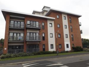 an apartment building on the corner of a street at The Light Buildings in Preston